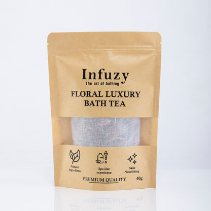 A package of Infuzy Floral Luxury Bath Tea with a visible clear window showing the tea bags inside. The packaging is primarily beige with black and white text and design elements, indicating premium quality and containing 40g of product.