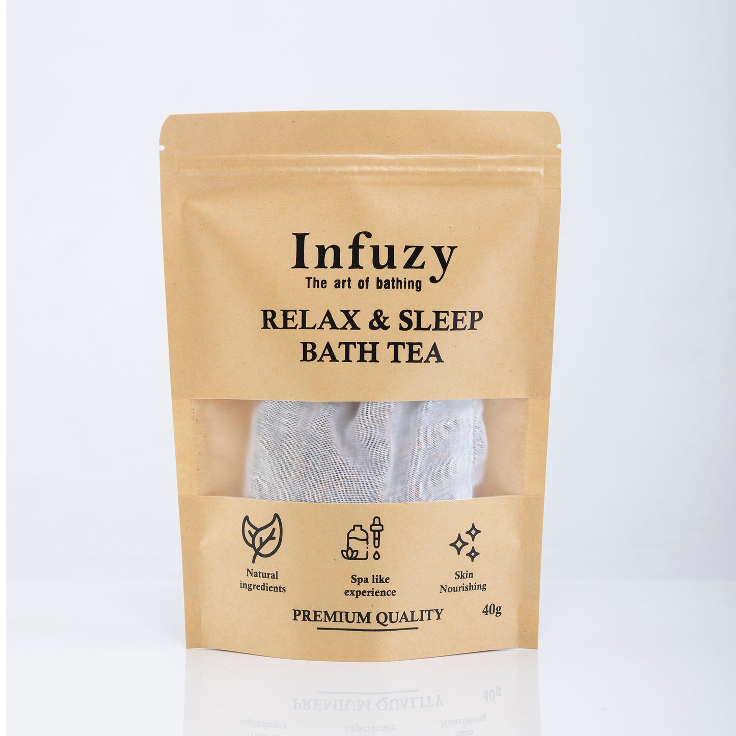 Packaging of Infuzy Relax & Sleep Bath Tea with a visible tea bag through the clear window, in a brown craft paper pouch with text detailing the product name and benefits.