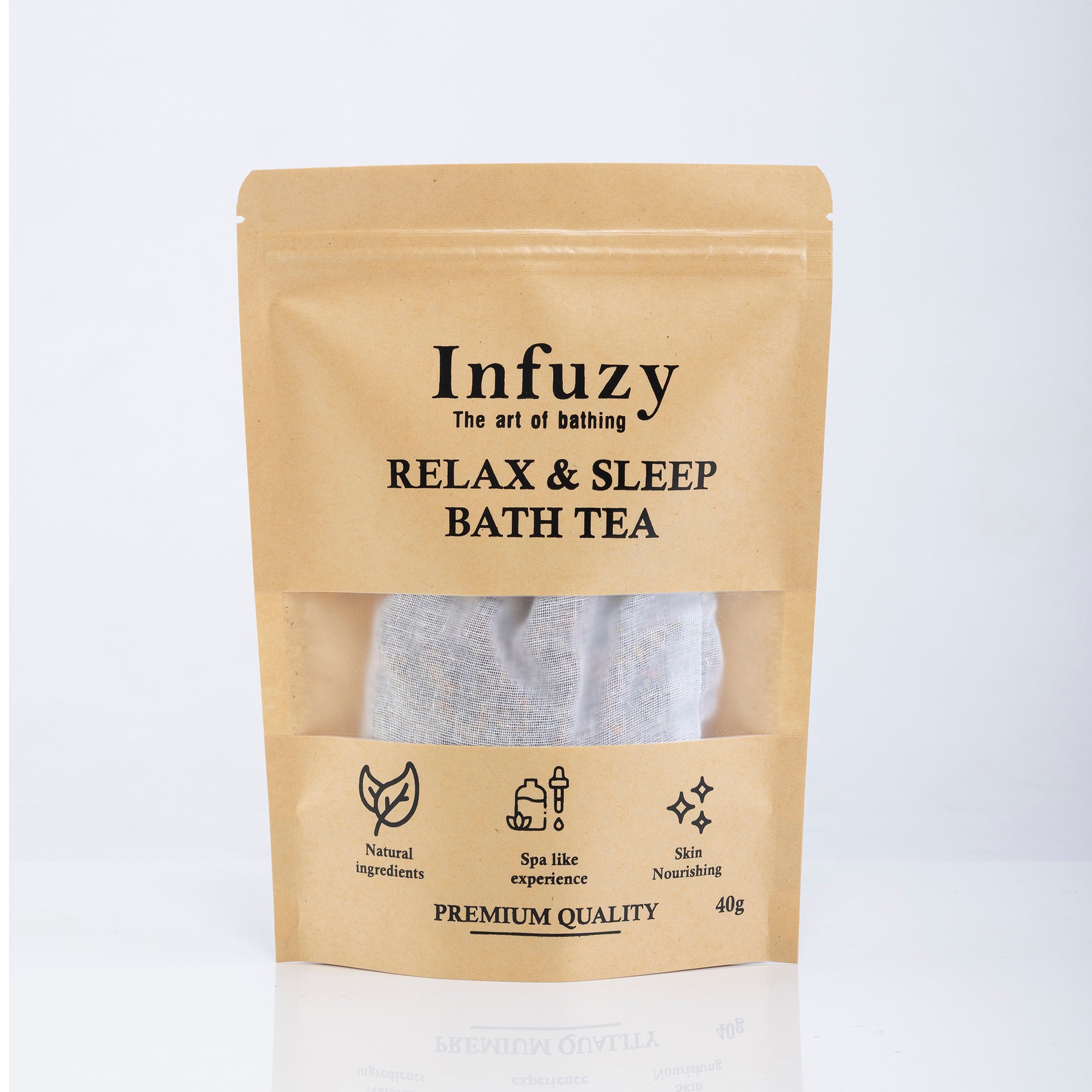 Packaging of Infuzy Relax & Sleep Bath Tea with a visible tea bag through the clear window, in a brown craft paper pouch with text detailing the product name and benefits.