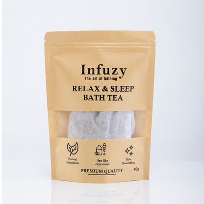 Packaging of Infuzy Relax & Sleep Bath Tea with a visible tea bag through the clear window, in a brown craft paper pouch with text detailing the product name and benefits.