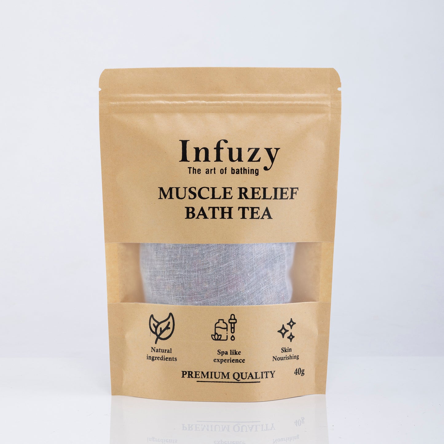 A package of Infuzy Muscle Relief Bath Tea with a visible tea bag through a clear window, labeled as premium quality with various benefits listed, such as all-natural ingredients and 45g weight.