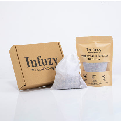 Infuzy packaging including a box, a white bag, and a package of goat milk bath tea on a white background.