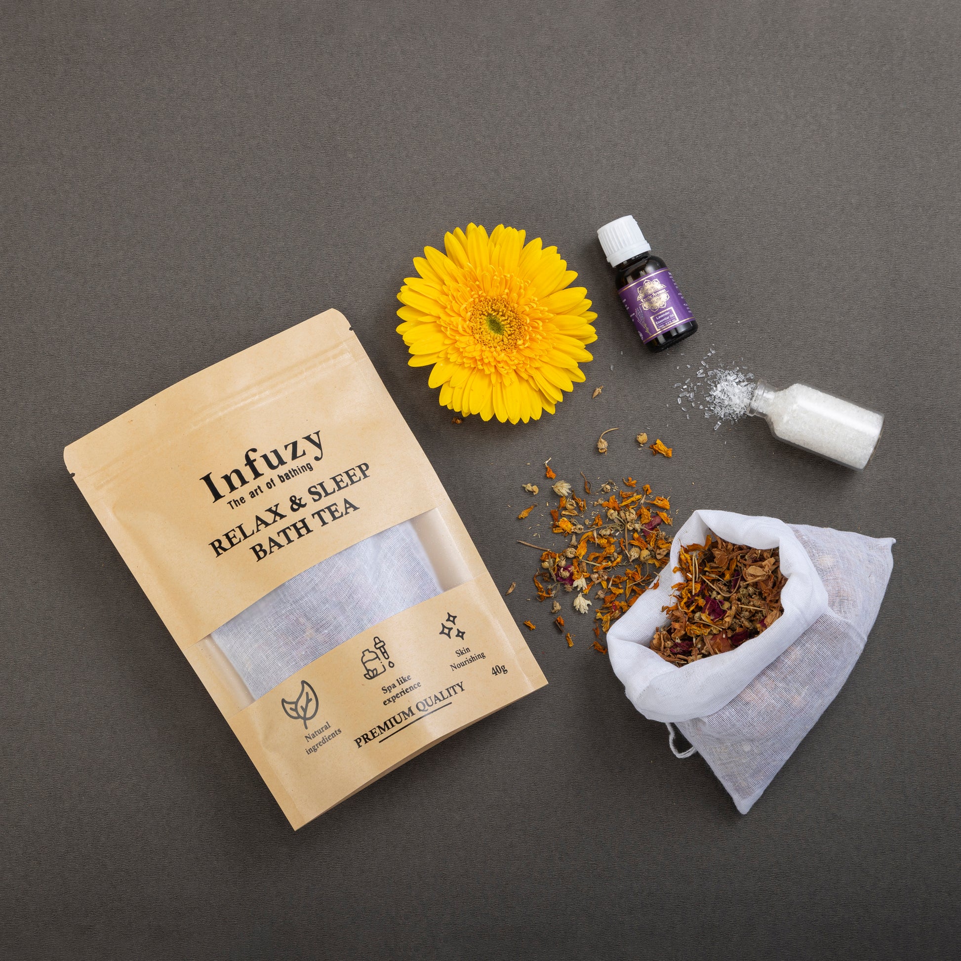 Infuzy relax and sleep bath tea packaging with a yellow flower and essential oil bottle on a gray background