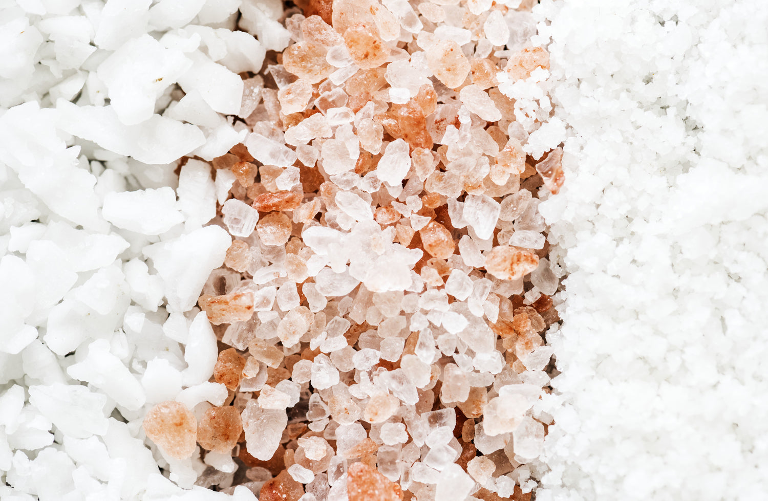 Close-up of dead sea salt ,epsom salt and pink Himalayan salt crystals